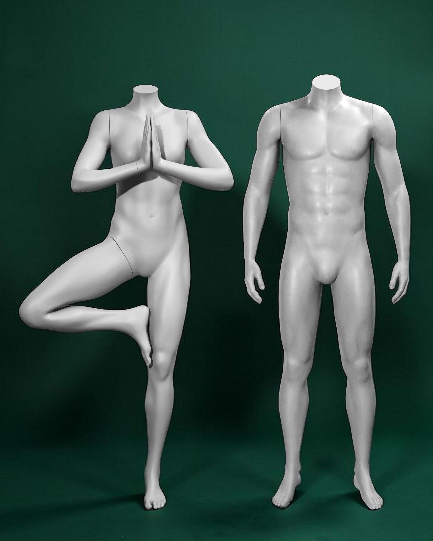Two mannequins in yoga poses on a green background