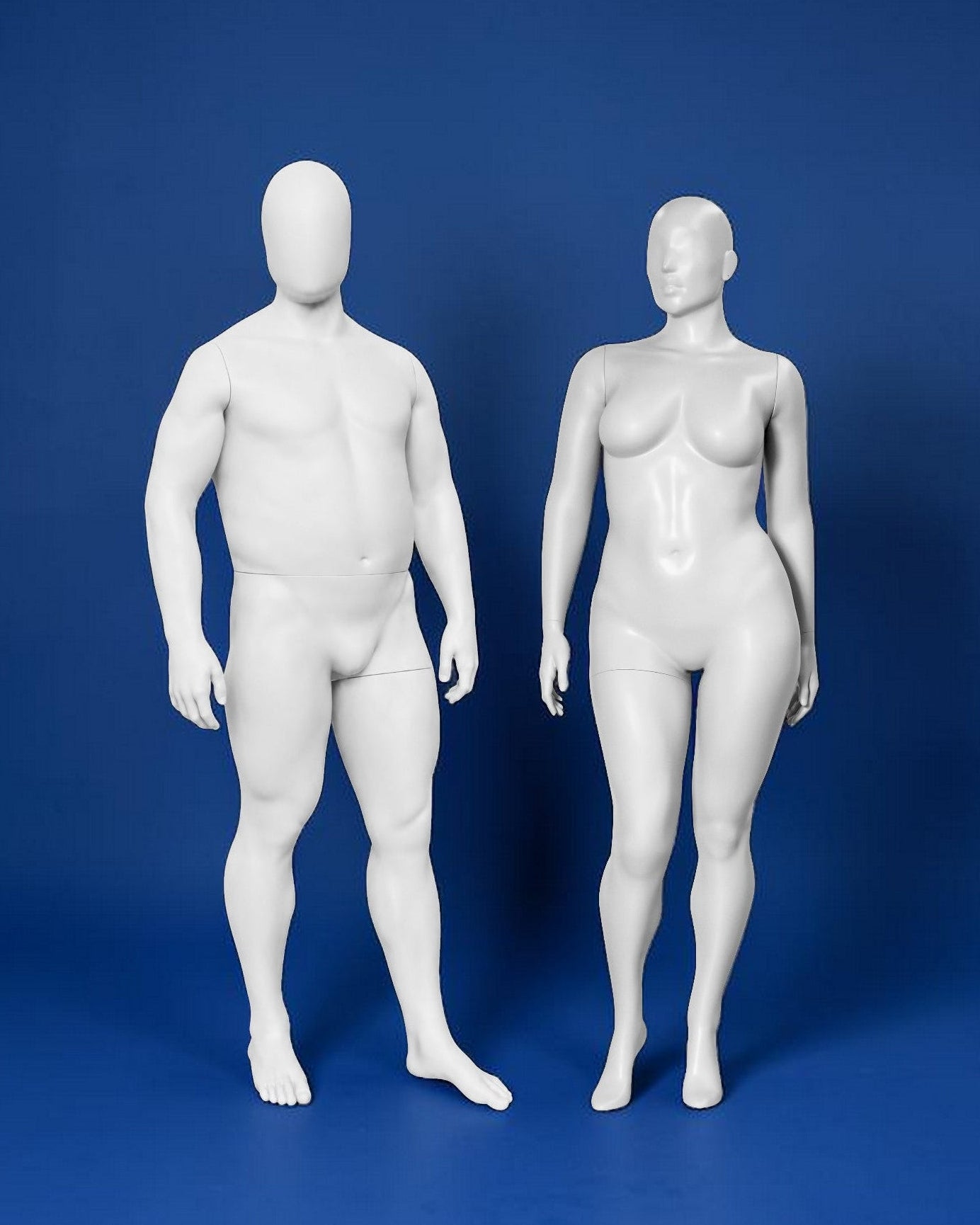 White male and female mannequins on a blue background